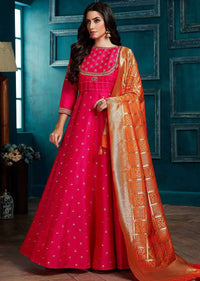 Fuchsia Pink Anarkali Suit With Weaved Buttis And Carrot Orange Banarasi Dupatta Online - Kalki Fashion