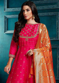 Fuchsia Pink Anarkali Suit With Weaved Buttis And Carrot Orange Banarasi Dupatta Online - Kalki Fashion