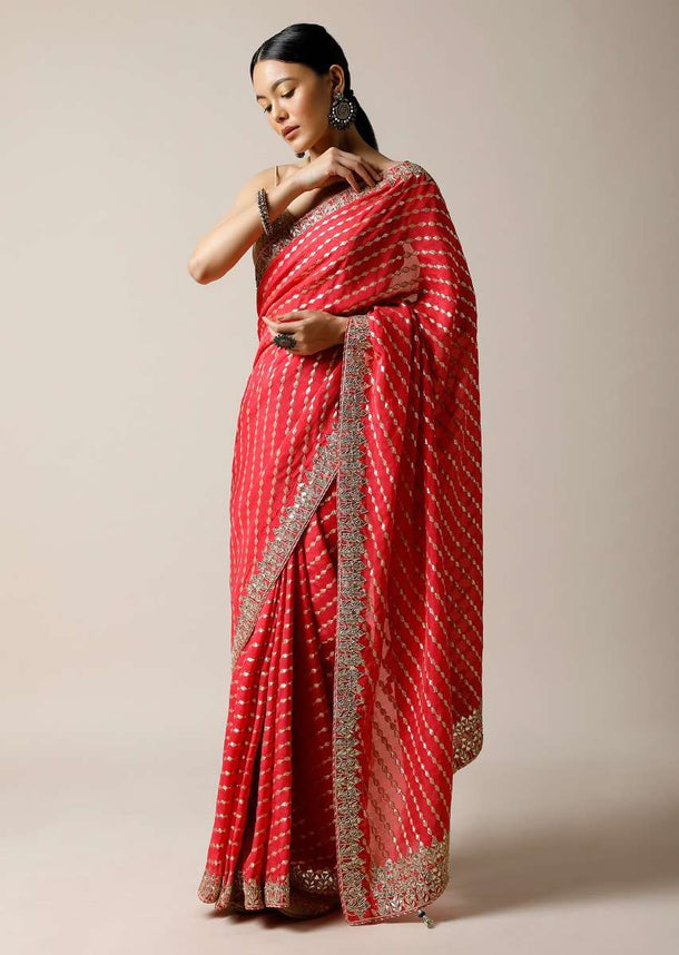 Fuchsia Pink Saree In Brocade Silk With Woven Stripes And Gotta Embroidered Border Along With Unstitched Blouse