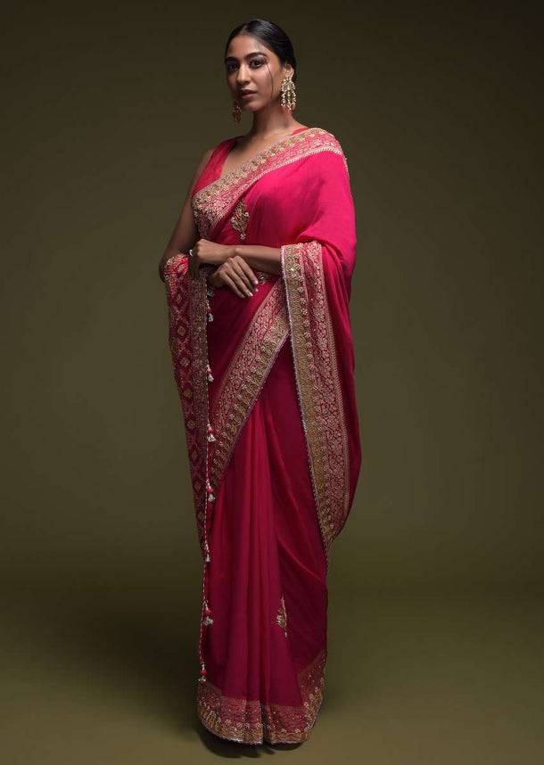 Magenta Pink Saree In Crepe Silk With Woven Floral Border And Gotta Patti Embroidered Floral Motifs