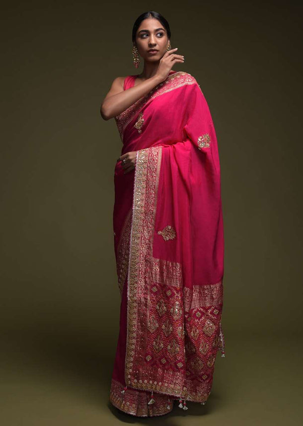 Magenta Pink Saree In Crepe Silk With Woven Floral Border And Gotta Patti Embroidered Floral Motifs