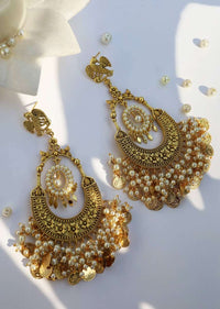Gold Chandbali Earrings Adorned In Rich Shell Pearls And Intricate Temple Detailing By Paisley Pop