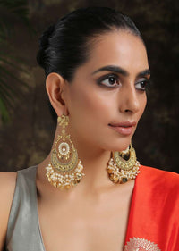 Gold Chandbali Earrings Adorned In Rich Shell Pearls And Intricate Temple Detailing By Paisley Pop