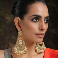 Gold Chandbali Earrings Adorned In Rich Shell Pearls And Intricate Temple Detailing By Paisley Pop