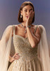 Gold Gown With Pleated Panels And Dramatic Cape