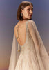 Gold Gown With Pleated Panels And Dramatic Cape