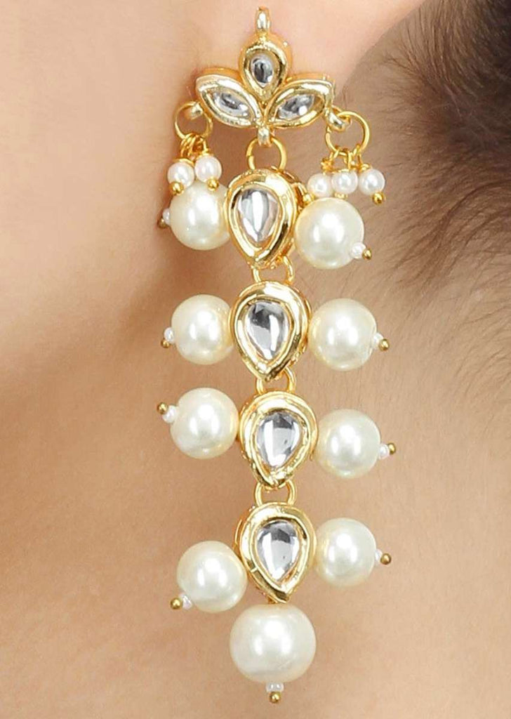 Gold Plated Earrings In A Long Sleek Design Embedded With Kundan And Pearls Online - Kalki Fashion