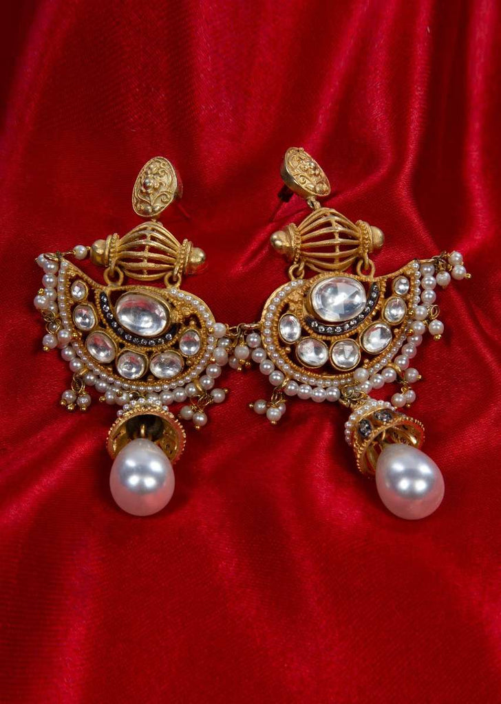 Gold plated fancy traditional earring adorn with kundan,moti stone and pearls only on Kalki