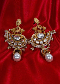 Gold plated fancy traditional earring adorn with kundan,moti stone and pearls only on Kalki