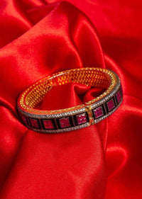 Gold plated kada with black stone and fuchsia beads only on Kalki