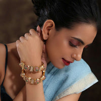 Gold Plated Kundan Bangles With Pink And Green Stones And Embossed Temple Work By Paisley Pop