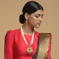 Gold Plated Kundan Necklace And Earrings Set With Pink Stone Studded Floral Motif And Strings Of White Beads Online - Kalki Fashion