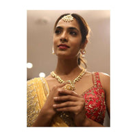 Gold Plated Necklace Studded With Kundan And Pearls Along With Round Pendant And Dangling Tassel Online - Kalki Fashion