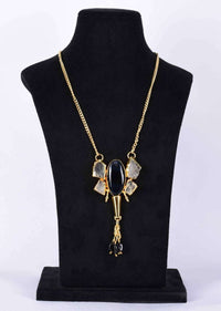 Gold plated party necklace with tribal style  broach in semi precious stone and black stone only on Kalki