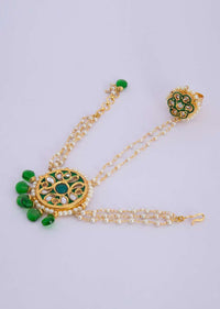 Gold played ring and detached bracelet adorn with green beads, moti and kundan only on Kalki