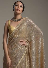 Gold Saree Embellished In Sequins With Moti Embroidered Border And Unstitched Blouse Online - Kalki Fashion