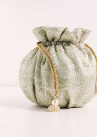 Gold Toned Sequins Potli Bag With Pearl Handle