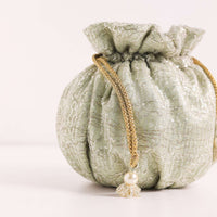 Gold Toned Sequins Potli Bag With Pearl Handle