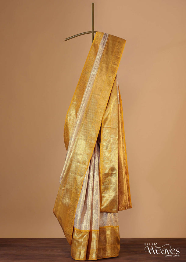 Gold-Toned Kanjivaram Saree In Tissue Fabric With 7gm Real Zari Border And Unstitched Blouser