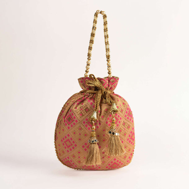 Gold Beige Potli Bag In Brocade Silk With Pink Geometric Jaal Design Online - Kalki Fashion