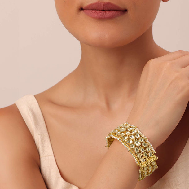 Gold Finish Kundan Bangle With Embellished Pearls