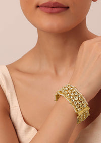 Gold Finish Kundan Bangle With Embellished Pearls