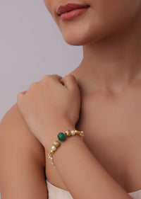 Gold Finish Mix Metal Bracelet With Green Kundan And Pearls