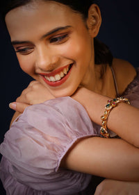 Gold Plated Bangle With Pink And Green Stones And Moti Work