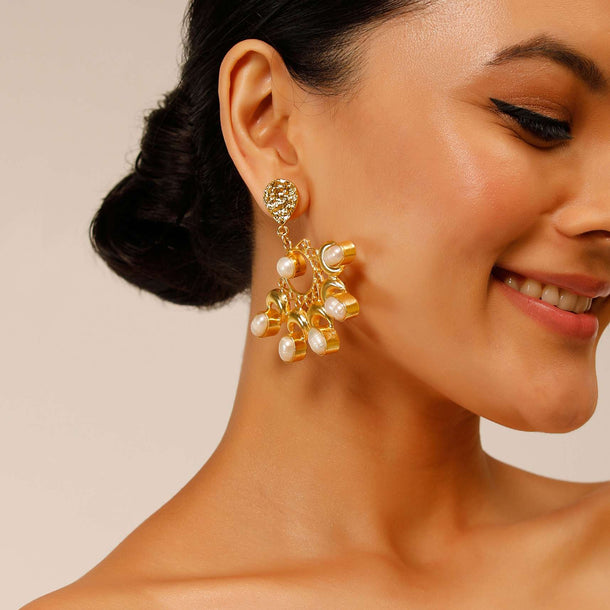 Gold Plated Earrings With Pearls Studded On A Floral And Crescent Shaped Design