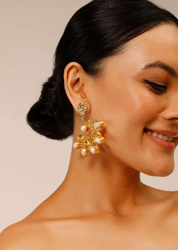 Gold Plated Earrings With Pearls Studded On A Floral And Crescent Shaped Design