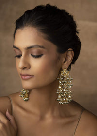 Gold Plated Kundan And Pearl Earrings With A Floral Motif