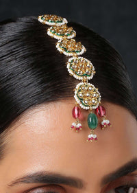 Gold Plated Mangtika With Intricate Kundan Motifs And Dangling Red And Green Stones