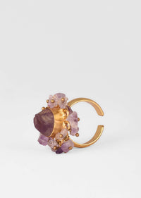 Gold Plated Ring With A Pale Purple Semi Precious Stone Centre And Tiny Stone Pieces All Over