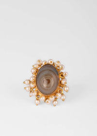 Gold Plated Ring With An Oval Shaped Grey Semi Precious Stone And Moti Tassels