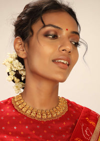 Gold Plated Temple Necklace With Goddess Laxmi Work And Pearls