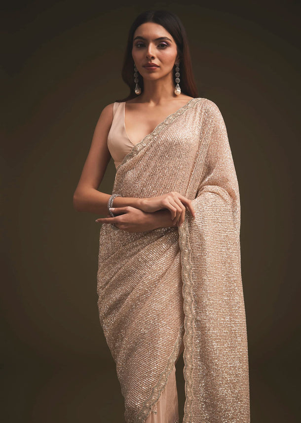 Gold Sequins Saree With An Embellished Border
