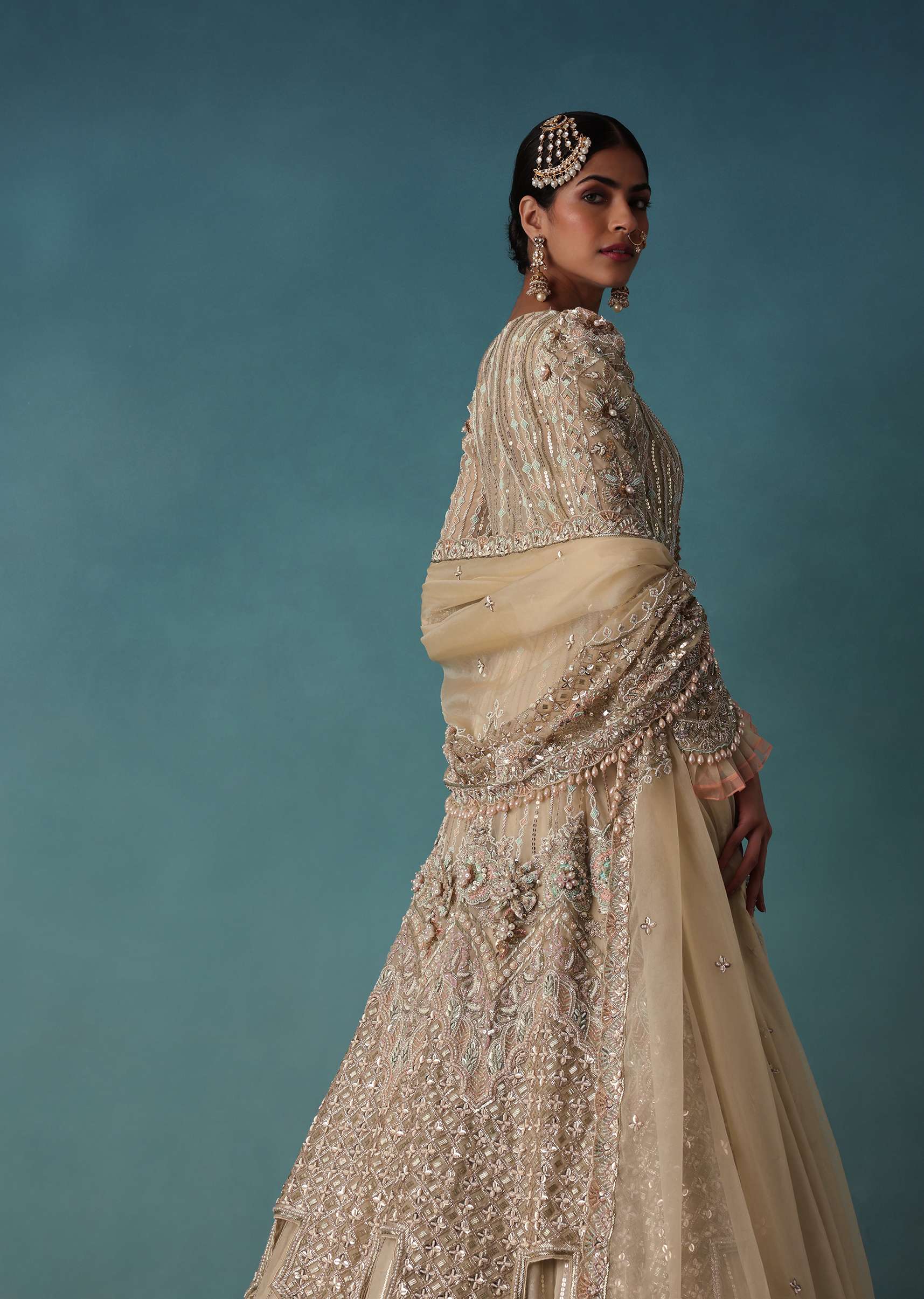 Gold Toned Embroidered Bridal Lehenga And Heavy Tube Top With Jacket