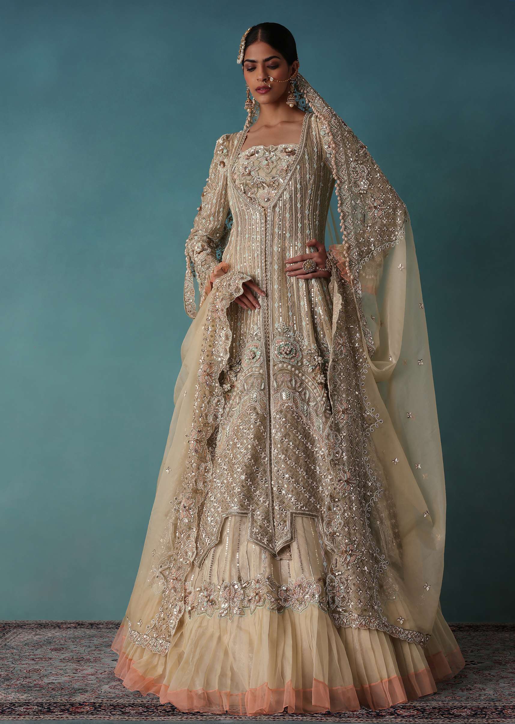 Gold Toned Embroidered Bridal Lehenga And Heavy Tube Top With Jacket