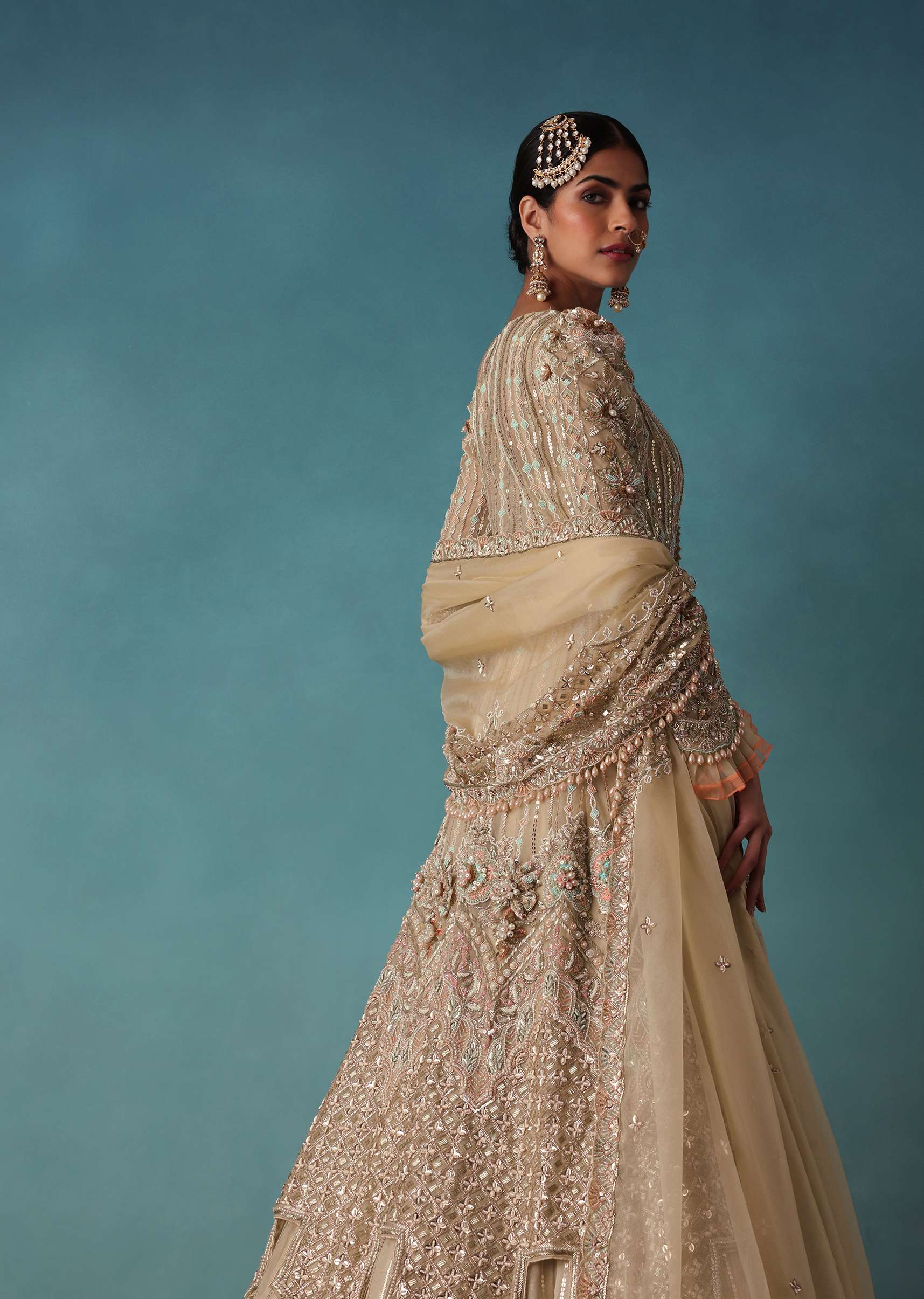 Gold Toned Embroidered Bridal Lehenga And Heavy Tube Top With Jacket