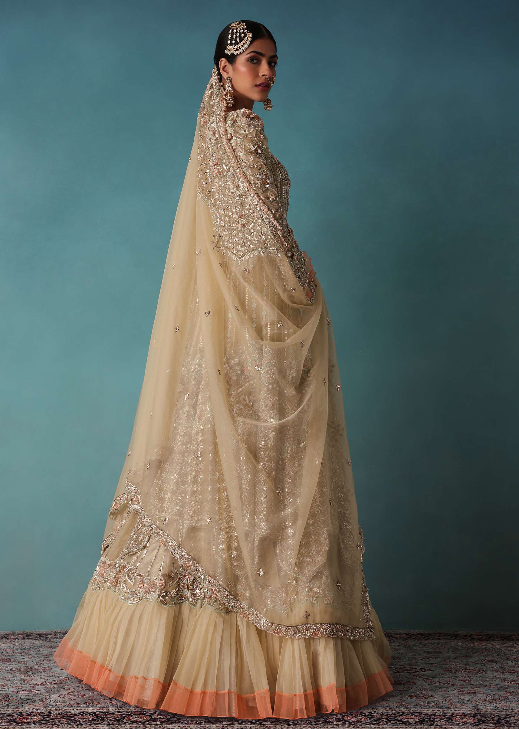 Gold Toned Embroidered Bridal Lehenga And Heavy Tube Top With Jacket