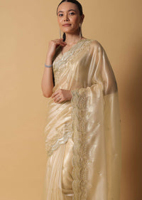 Gold Toned Foil Saree Fabricated In Tissue With Cut Dana Embellished Borders