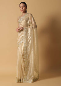 Gold Toned Foil Saree Fabricated In Tissue With Cut Dana Embellished Borders