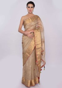 Golden beige organza saree with brocade border only on Kalki