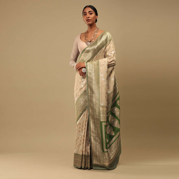 Golden Beige Saree In Art Handloom Silk With Green Woven Border And Two Toned Buttis Along With Unstitched Blouse