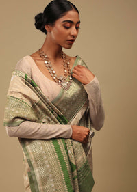 Golden Beige Saree In Art Handloom Silk With Green Woven Border And Two Toned Buttis Along With Unstitched Blouse