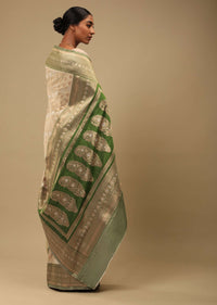 Golden Beige Saree In Art Handloom Silk With Green Woven Border And Two Toned Buttis Along With Unstitched Blouse