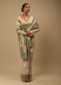 Golden Beige Saree In Art Handloom Silk With Green Woven Border And Two Toned Buttis Along With Unstitched Blouse