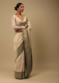 Golden Beige Saree In Art Handloom Silk With Green Woven Border And Two Toned Buttis Along With Unstitched Blouse