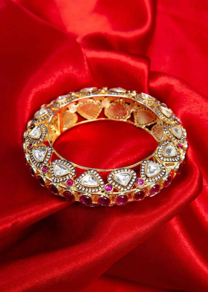 Golden cut out kundan kada adorn with kundan stone and fuchsia beads only on Kalki