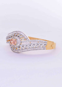 Golden metal coated golden kada studded with diamonds, buggle beads and honey beige crystal only on Kalki